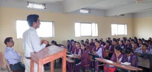 A tabby kitten with green eyes.