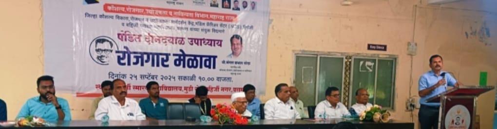 A light brown puppy standing on a white and tan woven pet bed.