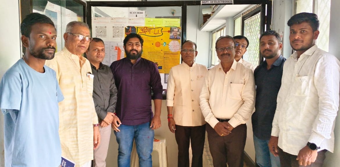 A light brown puppy standing on a white and tan woven pet bed.